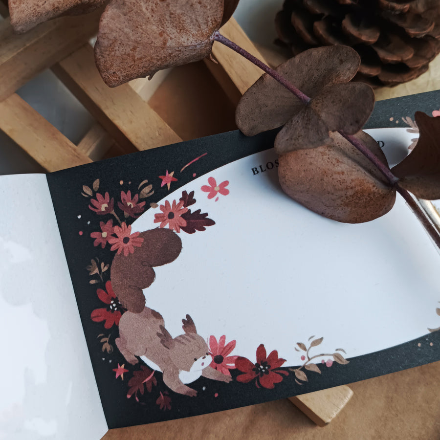 Wwiinngg notepad - celebration of petals