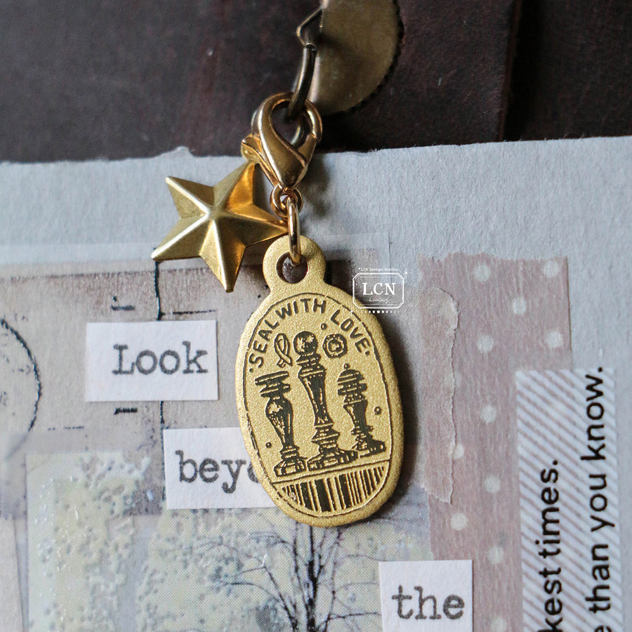 LCN brass charm