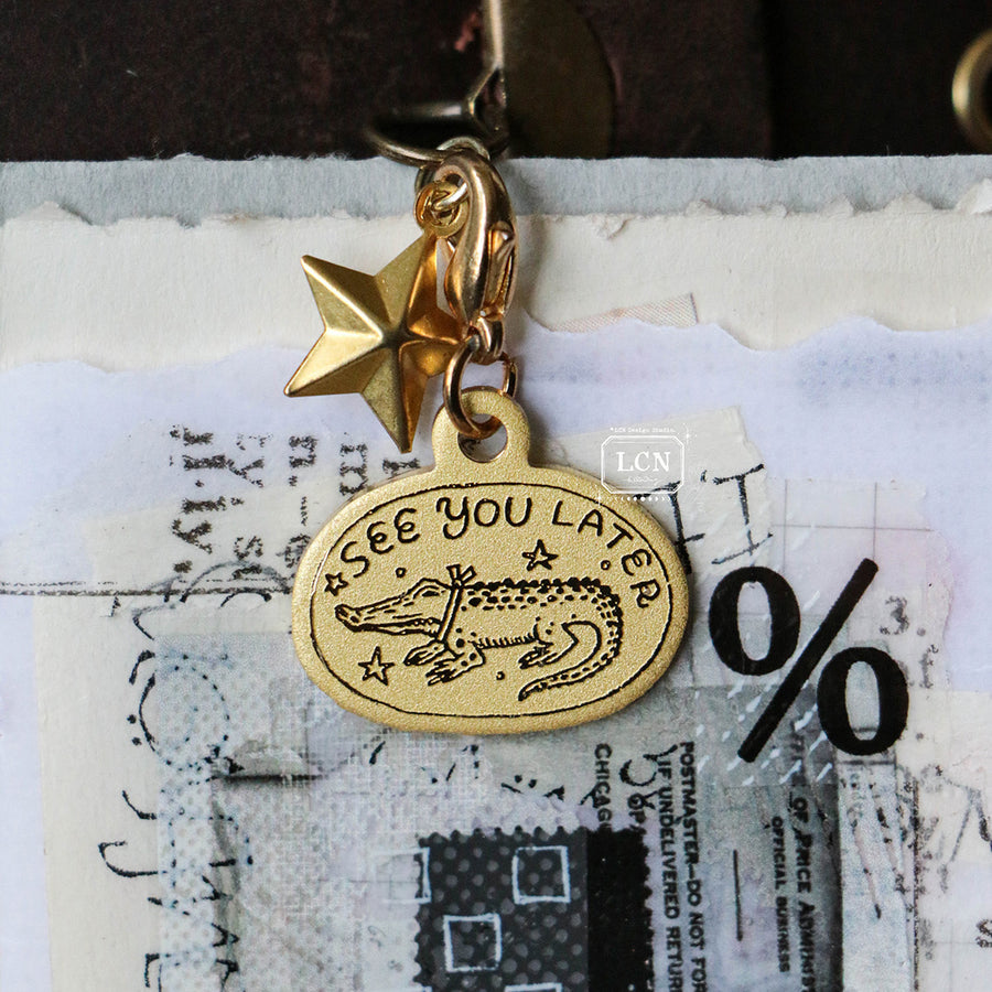 LCN brass charm
